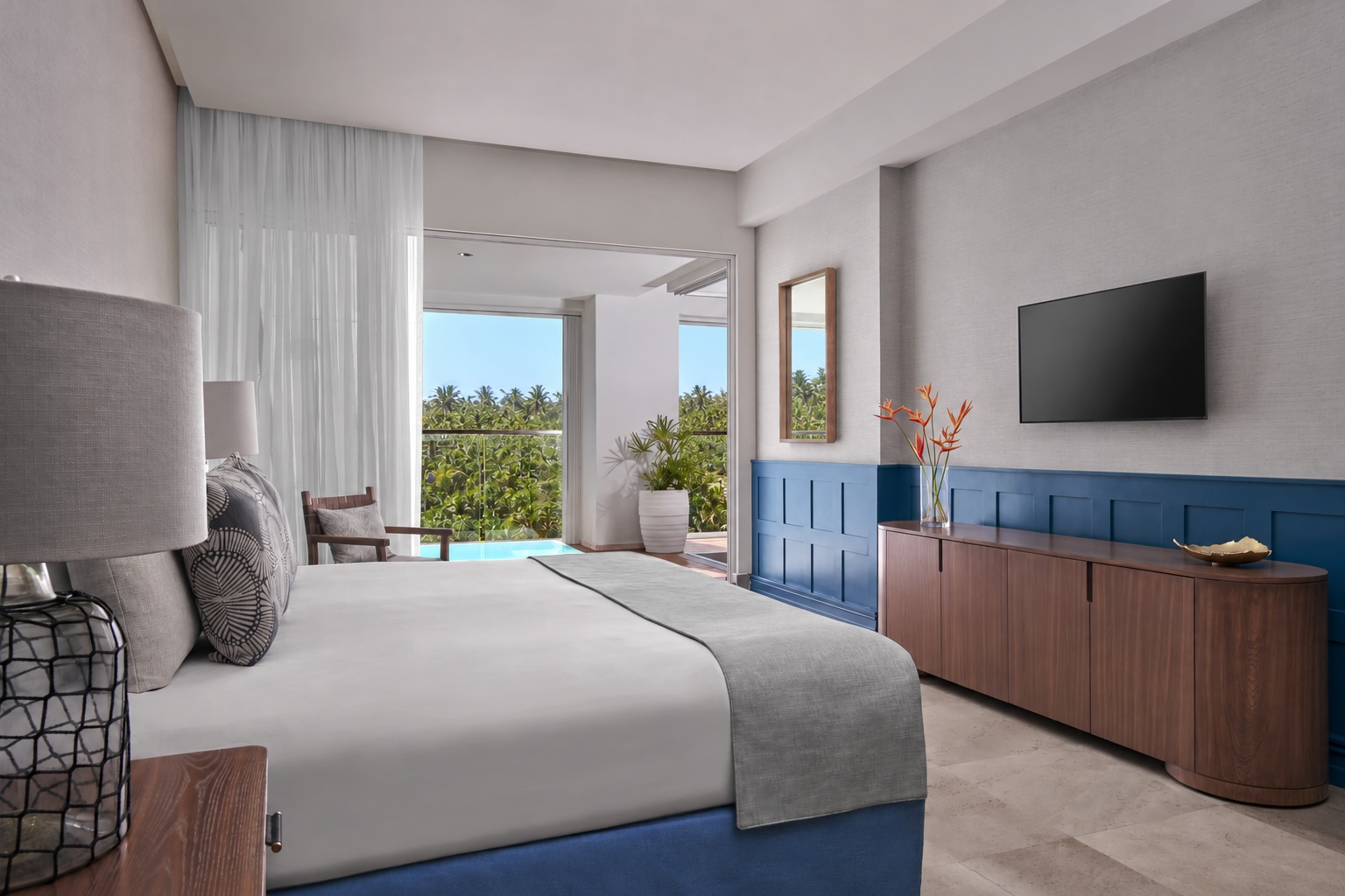 Bedroom of the One Bedroom Suite Deluxxe at The Grand Mayan, Vidanta Riviera Maya, featuring blue accents and private pool views